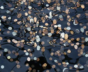 Know the Reason behind Throwing Coins in a River