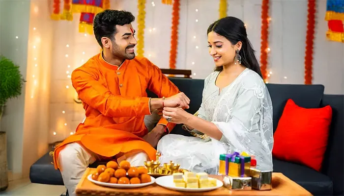 Sister tying Rakhi to Brother